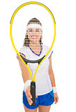 Happy female tennis player holding racket in front of face