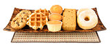 Cakes, cookies, donuts and waffels on the plate