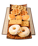 Cakes, cookies, donuts and waffels on the plate