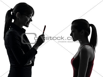 teacher woman mother teenager girl discussion  in silhouette