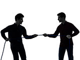 two  men twin brother friends tug of war silhouette