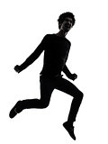 handsome african young man jumping screaming silhouette