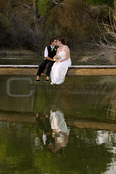 Kissing Female Couple at Lake