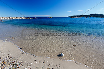 Sunny Beach and Breakwater in Antibes on French Riviera, France