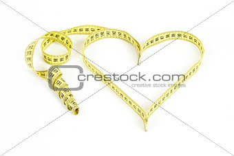 Tape measure heart shape - health, weight concept 