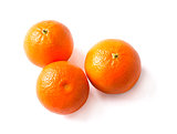 three ripe tangerine on a white background.