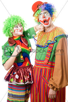 Female clown punching clown