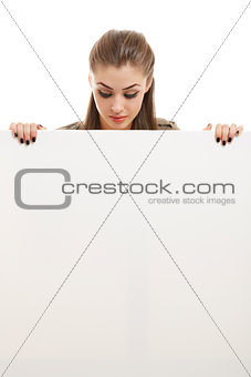 Business woman holding white billboard
