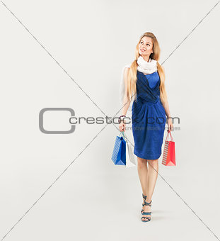 Beautiful Woman in Blue Dress with Shopping Bags
