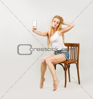 Blonde Woman Taking Self Portrait with Phone