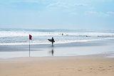 surfer walking kuta beach bali