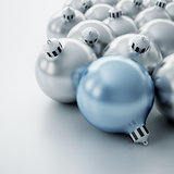 Christmas balls of silver and blue color on a white background