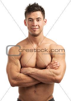 Portrait of a handsome young man with great physique posing against white background