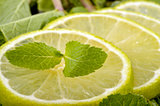 Lime slices and mint leaves