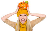 Girl in hat and scarf with jack-o-lantern on head