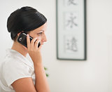 Young woman talking mobile phone