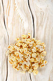 Heap popcorn on white table