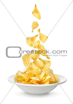 Potato chips falling in the plate