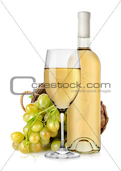 White wine bottle and grapes in basket