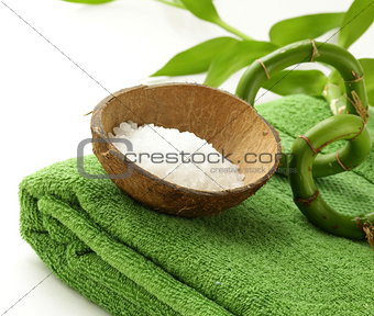 branch of bamboo, sea salt and towel - green spa concept