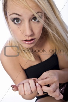 Studio portrait of a surprised young blond woman 