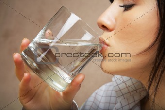 young woman with glass of mineral water
