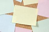 Close up of post-it notes on corkboard
