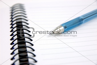 Blue pen on notebook