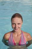 Beautiful young woman in  the swimming pool