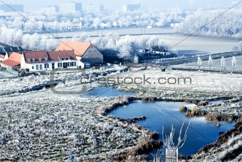 Winter landscape high view over a farmhouse