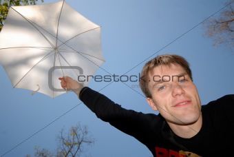 guy with white umbrella above head 