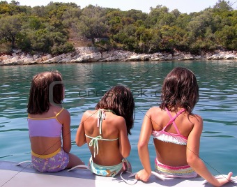little girls on the beach, summertime in Greece