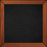 black leather background in wooden brown frame