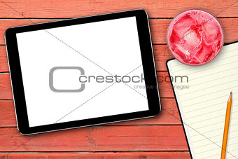 blank digital tablet on red wooden table
