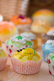 cupcakes muffins with cream fuits , breads, chocolate variety an