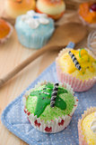 cupcakes muffins with cream fuits , breads, chocolate variety an
