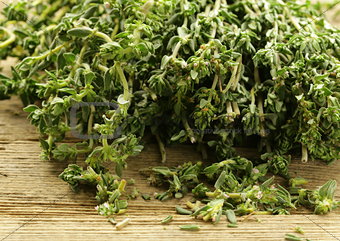 Organic fresh thyme on a wooden table