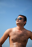 Happy indian man with sunglasses