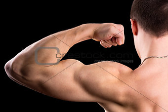 man's muscular arm