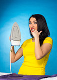 Houseworks, woman with pile of clothes for ironing