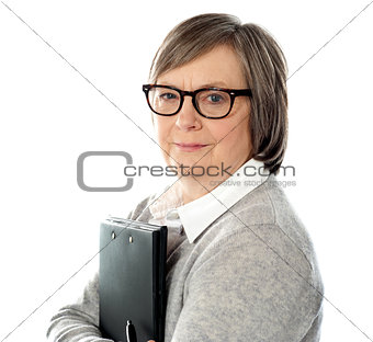 Attractive old orporate lady holding business document