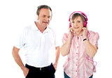 Happy aged couple enjoying music together