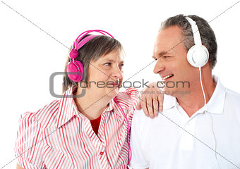 Romantic senior couple enjoying music together