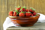 wooden bowl with ripe fresh strawberries