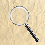 Crushed Paper With Magnifying Glass
