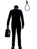 business man standing in front of  hangman noose silhouette rear