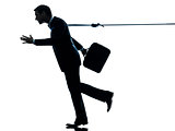 business man catched by lasso rope silhouette