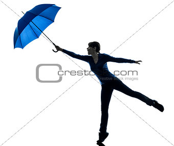 woman holding umbrella wind blowing silhouette
