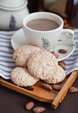 Almond cookies on a tray on the background of coffee cup