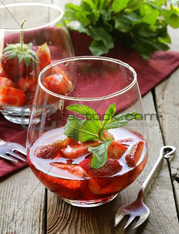 strawberry dessert in a glass - berries in syrup